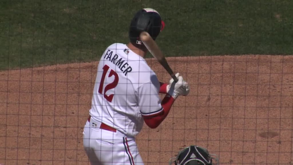 Kyle Farmer of the Minnesota Twins bats during a spring training