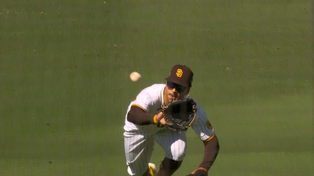 Trent Grisham San Diego Padres baseball player flipping someone