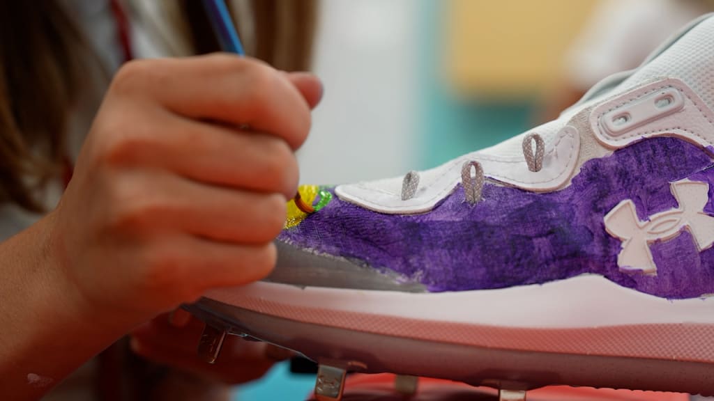 Reds kids create custom cleats