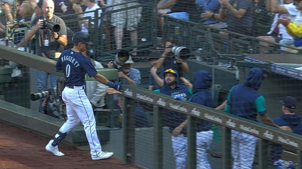 Seattle Mariners' Sam Haggerty walks to the dugout during a