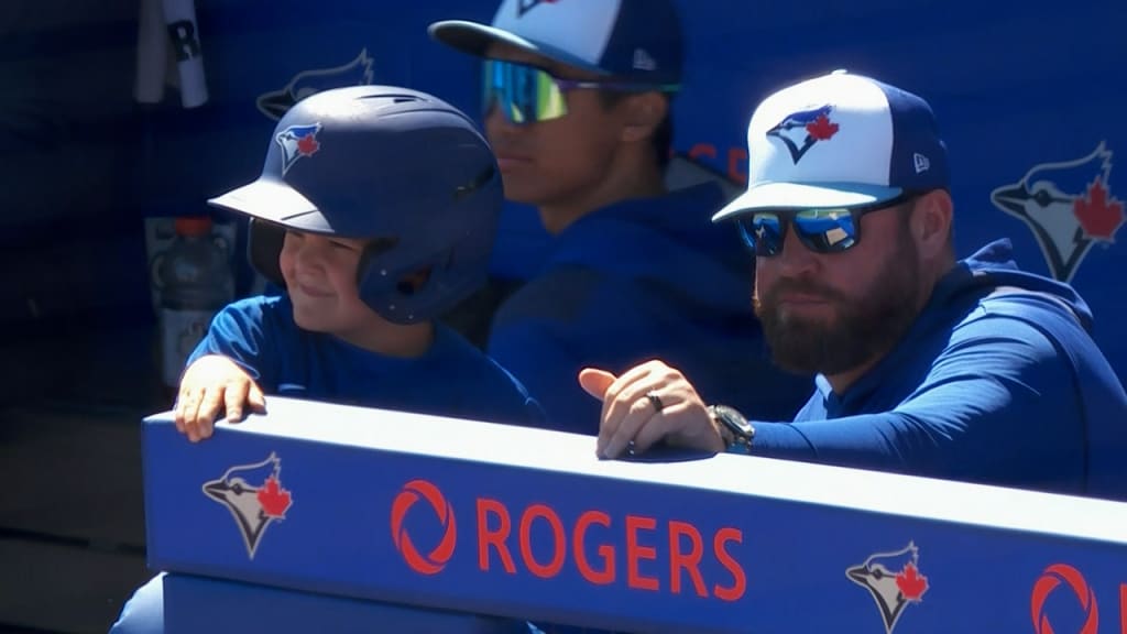 John Schneider welcomes his kids into the dugout
