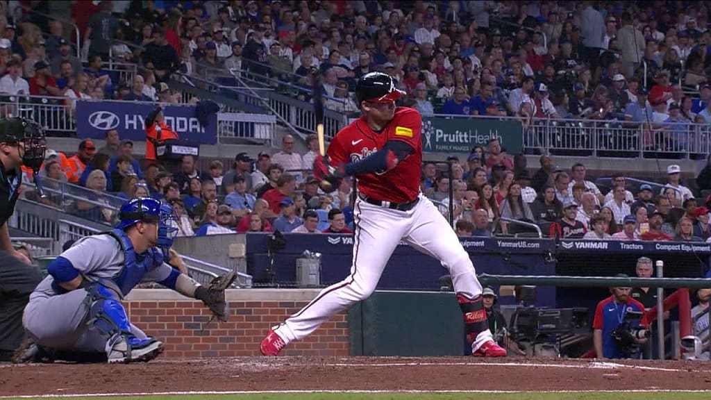 Austin Riley of the Atlanta Braves hits a triple during the third