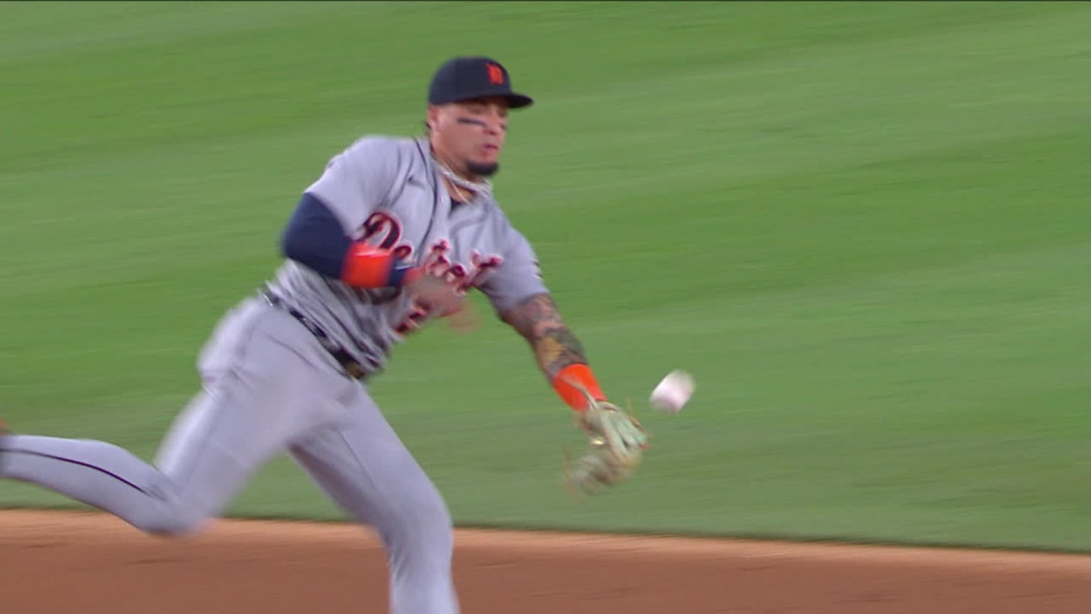 Detroit Tigers shortstop Javier Baez glove flips ball backward