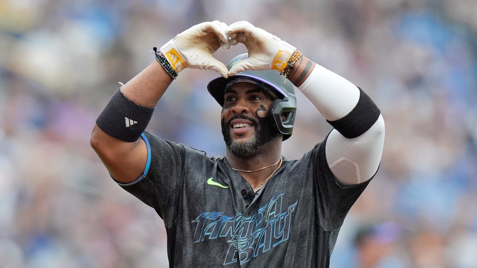 Yandy Díaz forming a heart with his gloved hands during a Tampa Bay Rays home-run celebration in May 2026