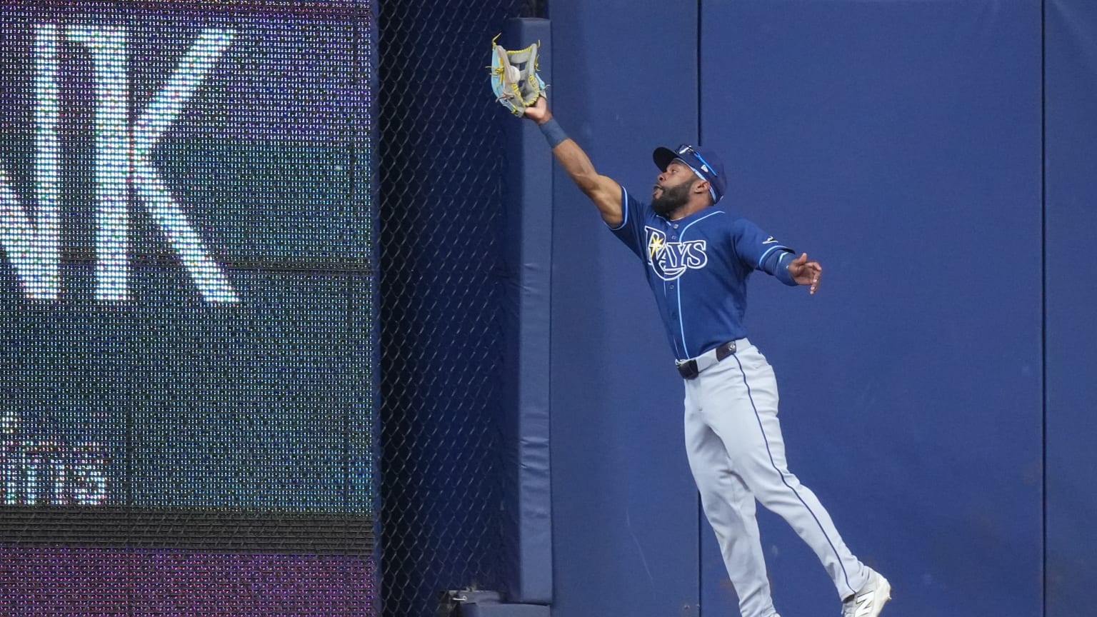 Cedric Mullins makes a leaping catch at the warning track for the Tampa Bay Rays