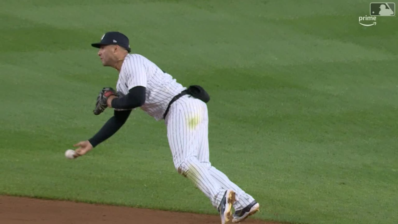 Derek Jeter of the New York Yankees turns a double play in the top