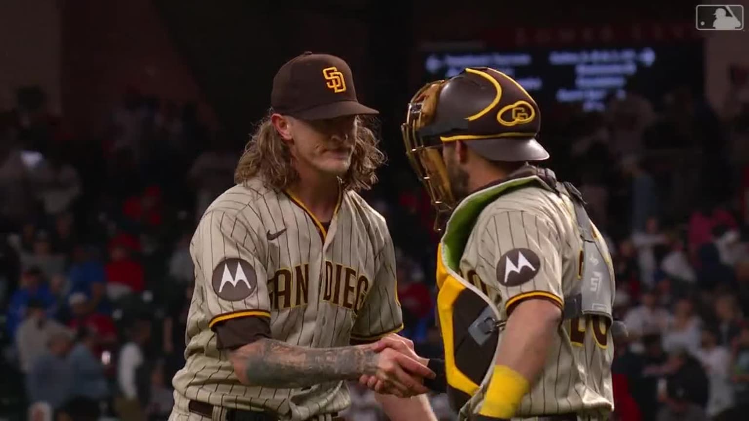 Josh Hader of the San Diego Padres poses for a photo with a fan