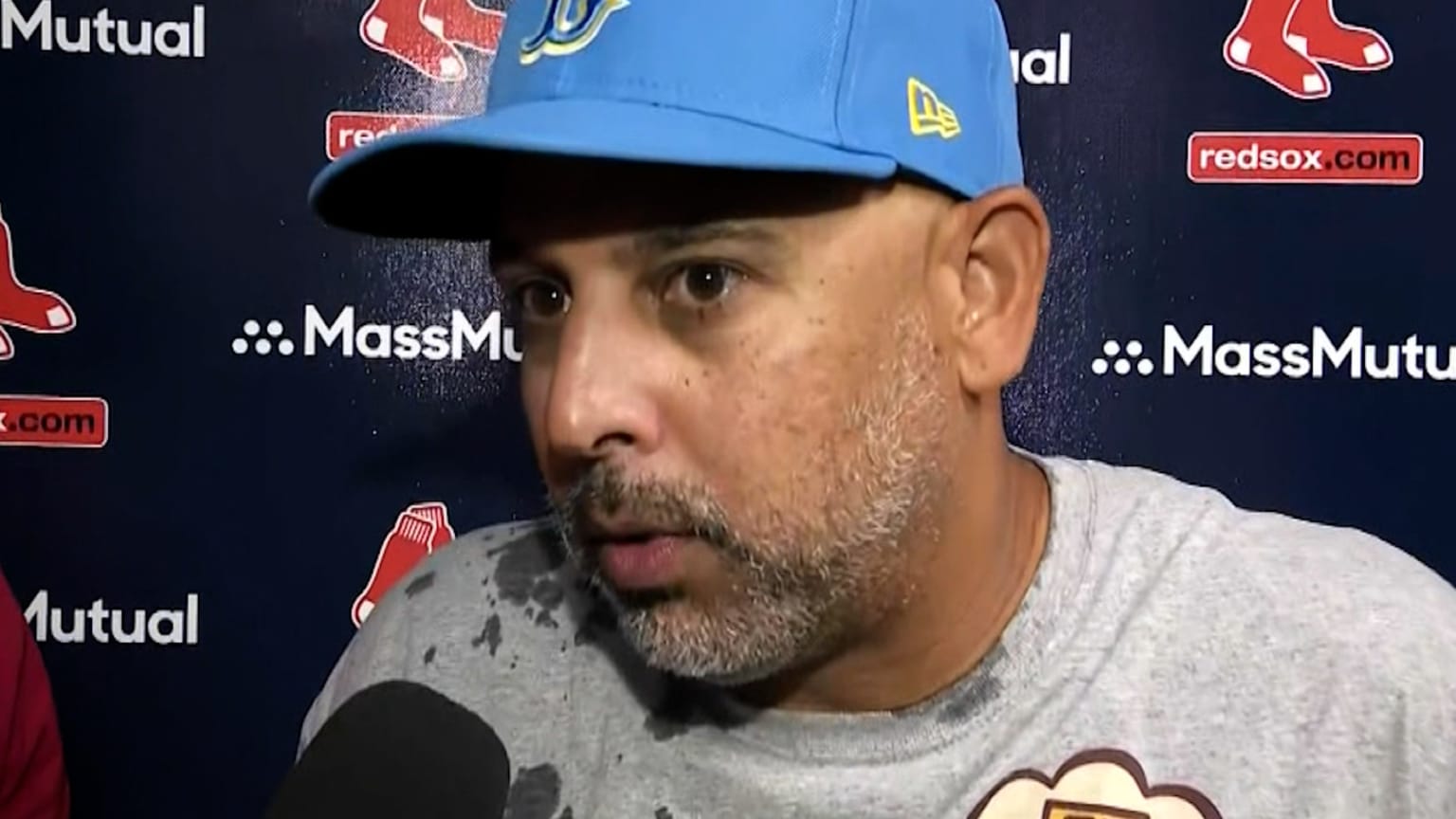 Boston Red Sox manager Alex Cora (20) talks with Minnesota Twins