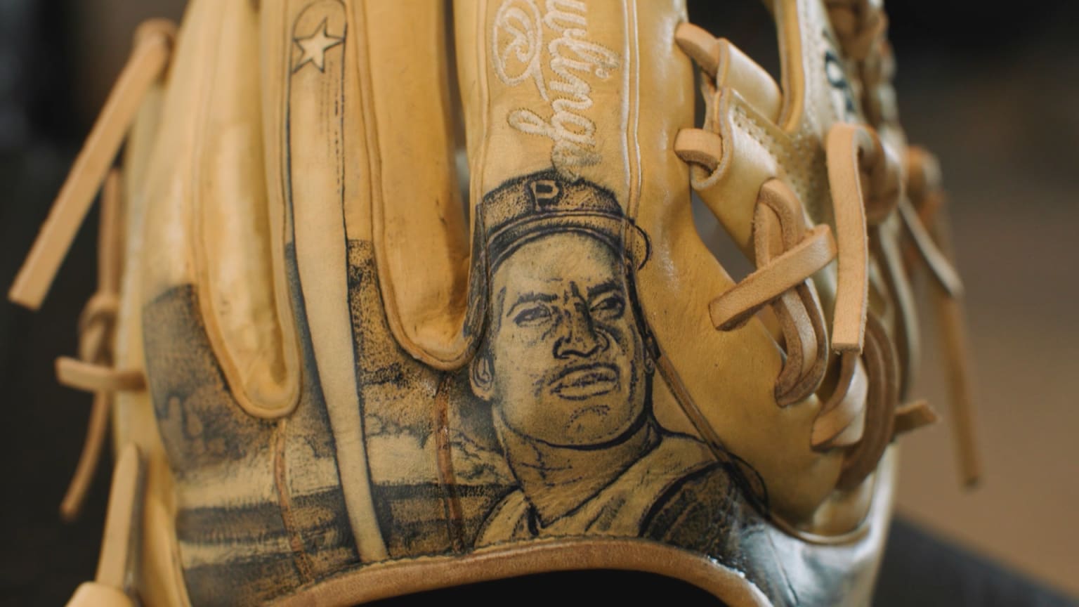 Clemente portrait on baseball glove | 09/15/2024 | MLB.com