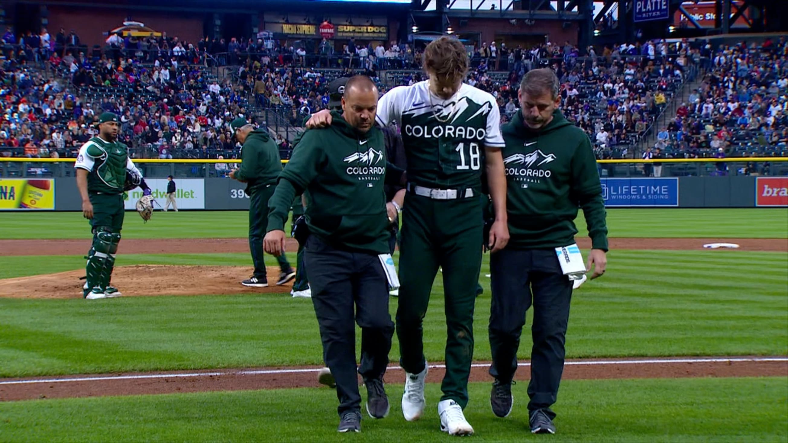 Fan hit in ear by line drive during Brewers/Rockies game