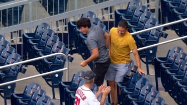 Fan makes an incredible catch in the stands