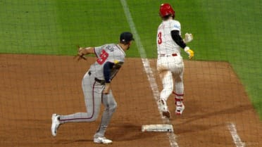 Bryce Harper reaches first after review