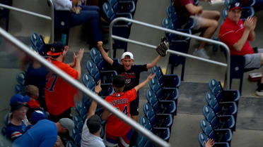 Young fan catches a souvenir