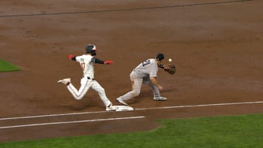 Edouard Julien safe at first after challenge