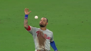 Philadelphia Phillies' Edmundo Sosa, bottom, slides safely into