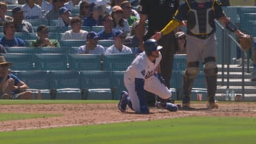 Max Muncy falls over home plate