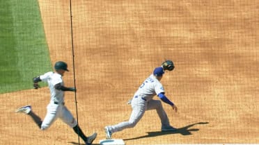 Miguel Rojas nabs Tyler Freeman at first after review