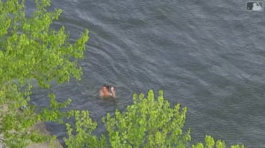 Fan jumps in river for HR ball 