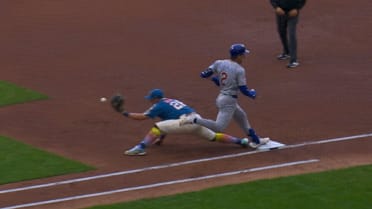 Nico Hoerner is safe at first after review