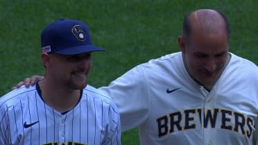 Andrew P. Poppas tosses out the first pitch
