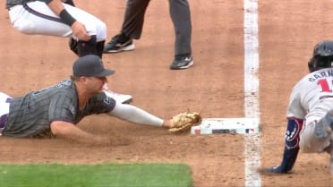 Pete Alonso tags first base with a slide