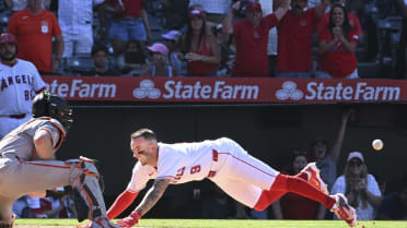 Zach Neto scores the game-winning run after review