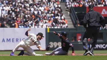 Steven Kwan steals second base after review