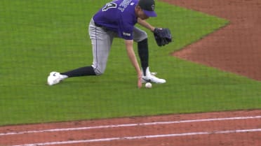 Jimmy Herget pushes ball to first base for out