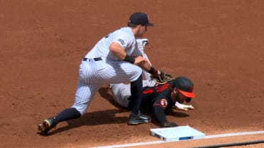 Taylor Ward safe at first base stands
