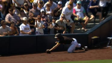 Padres' ball attendant makes a diving catch