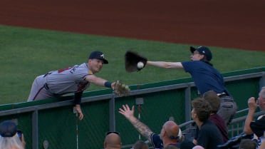 Mike Yastrzemski flips over the rail