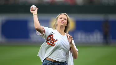 Katherine Lee Henderson throws out first pitch