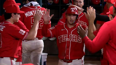 Wyatt Langford scores on throwing error