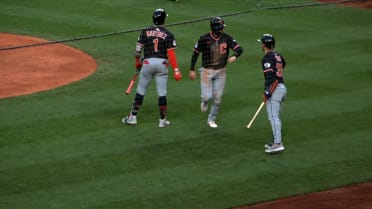 Daniel Schneemann scores on a wild pitch
