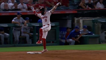 Zach Neto reaches with single after review