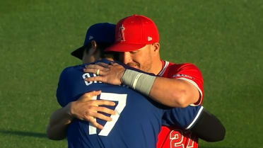 Mike Trout and Shohei Ohtani embrace in the outfield 