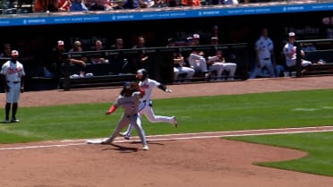 Taylor Ward ruled safe at first base after review