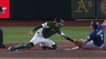 Lawrence Butler nabs Cole Young at home after review