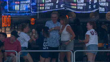 Fans show excitement after catching a foul ball