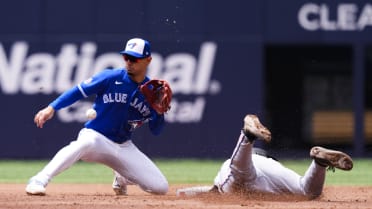 Xavier Edwards steals second after challenge