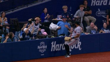 Rays fan attempts to catch a ball with a hockey glove