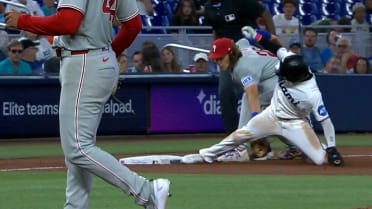 Realmuto nabs Sanoja at third base after review