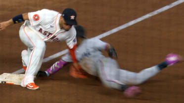 Esteury Ruiz is ruled safe at third base