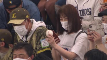 Fans pass Ohtani's home run ball
