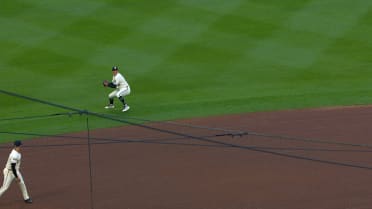 Brooks Lee fields, makes throw from outfield grass