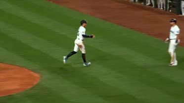 Dylan Moore scores on a wild pitch