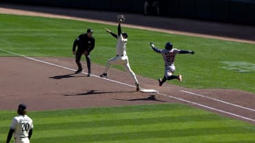 Jose Altuve is safe at first after review