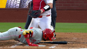 Luis Arraez does a push-up during his at-bat
