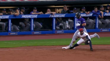 Kyle Farmer is safe at first after review