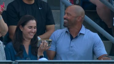 Parents watch Jacob Lombard hit his first home run